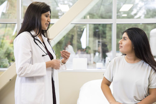 A doctor talking to a patient.