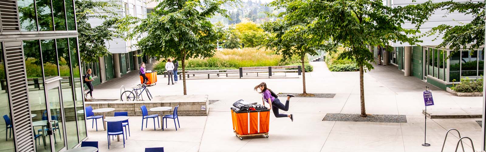 Student kicking heels in air while moving in at Mercer Court