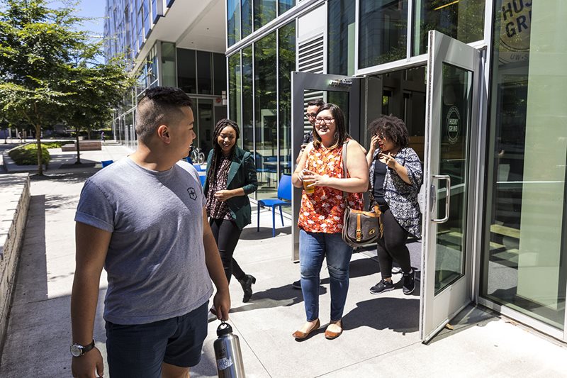 Students taking a tour on campus on a sunny day