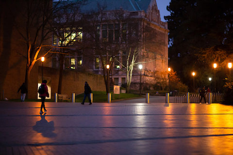 Student walking through Red Square in the dark