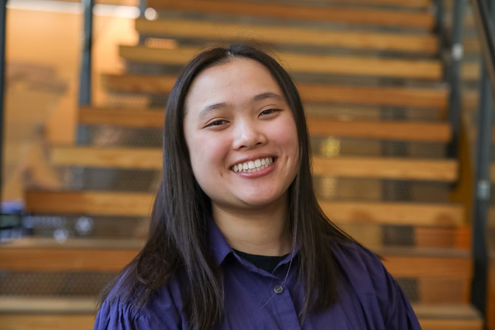 Woman in blue shirt smiling