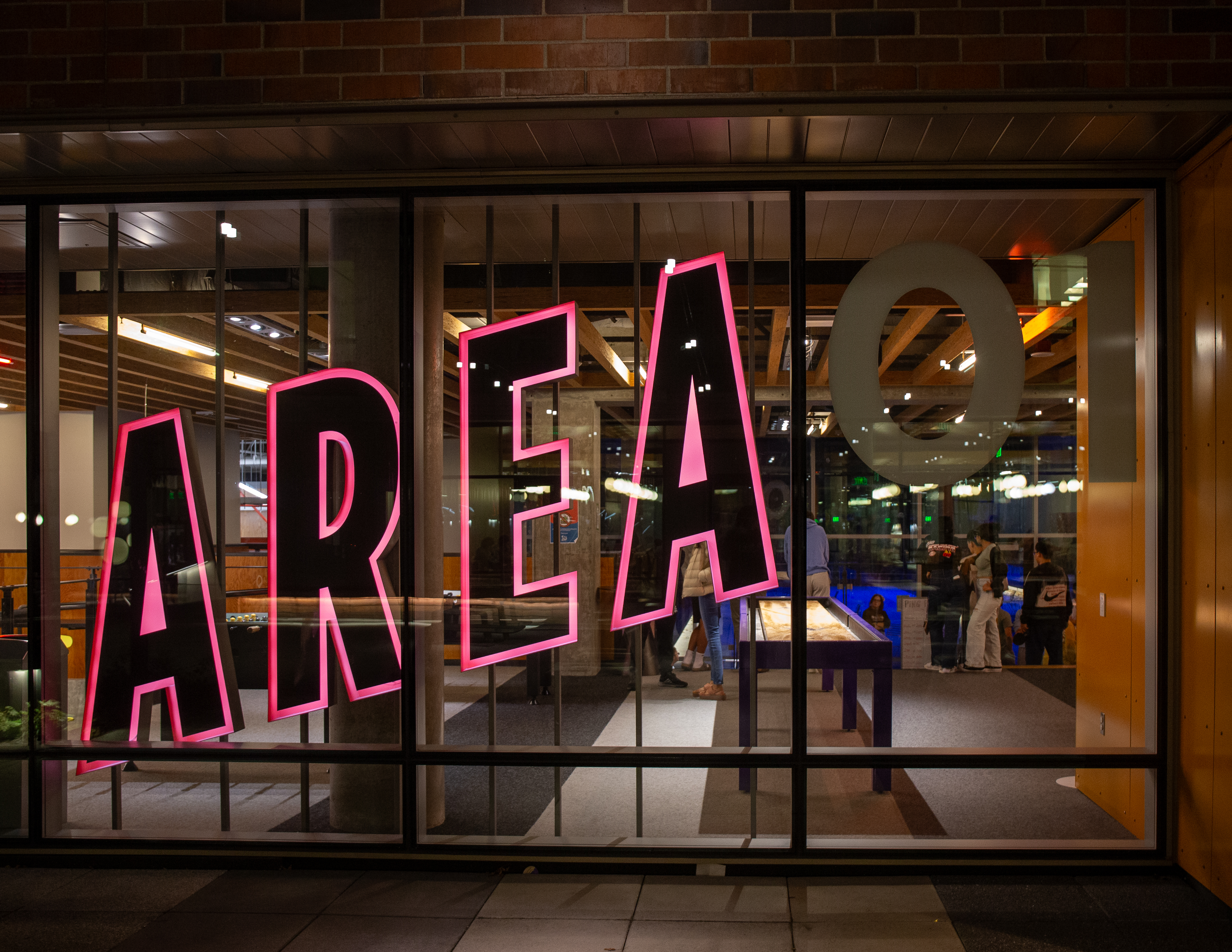 Window with a big light-up sign that reads AREA 01 in red