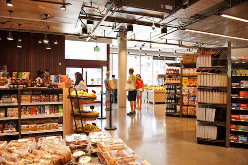 Shoppers walking around grocery store