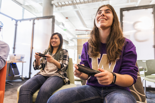 Students playing video games in Area 01